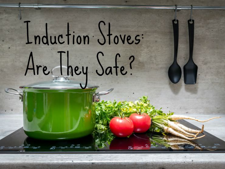 induction stove with green crockpot and tomatoes on the cooktop