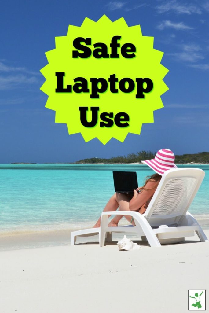 woman using a laptop in a chair at the beach