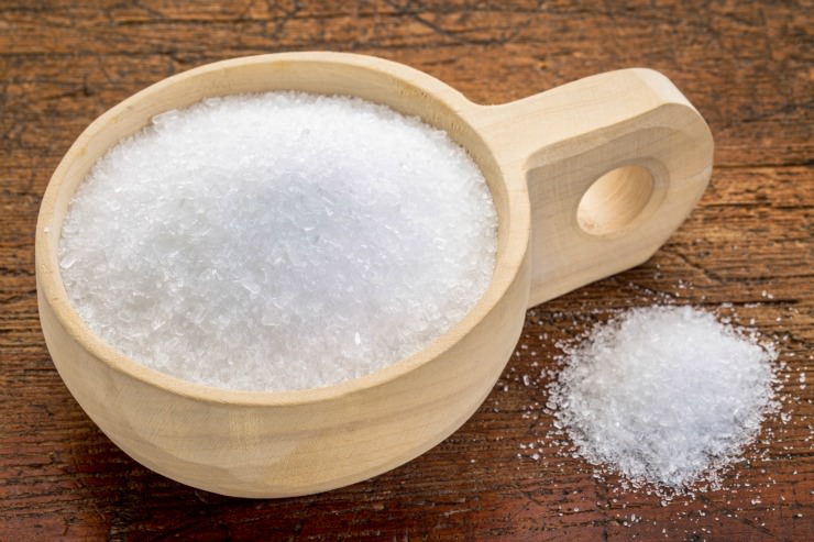 epsom salt bath container on wooden background