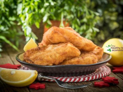 healthy fish fingers on platter with lemon