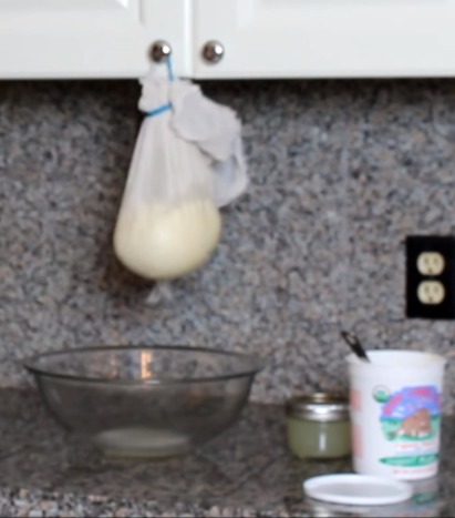 whey dripping into a bowl