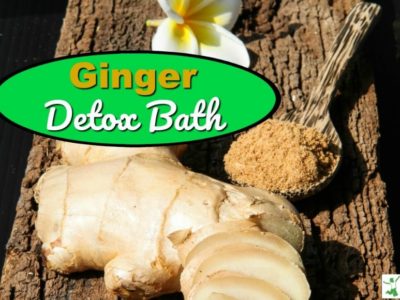 fresh ginger root and powder with a flower on a table