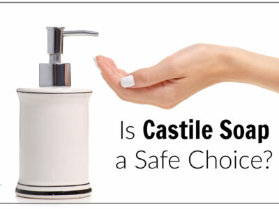 woman pumping castile soap on hand from white dispenser