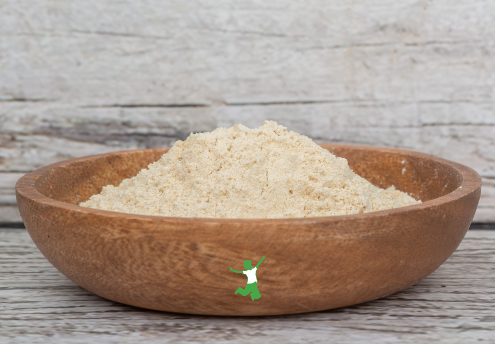 hormone balancing maca powder in a wooden bowl