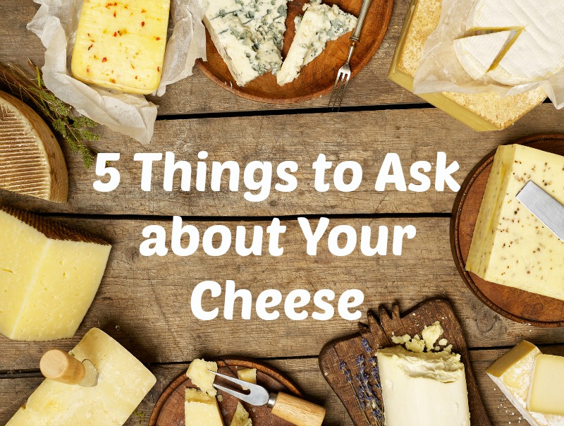 assorted healthy cheeses on a bread board