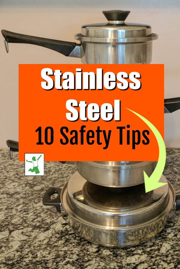stainless steel pans stacked on a table