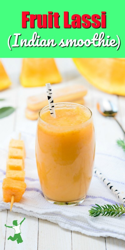 fruit lassi in a tall glass with a straw