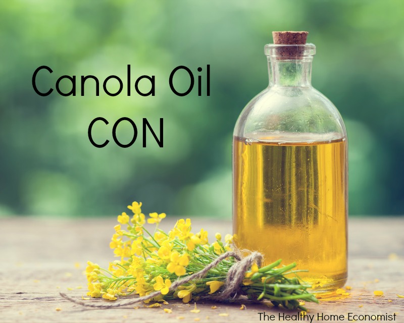 toxic cold-pressed canola oil bottle green background