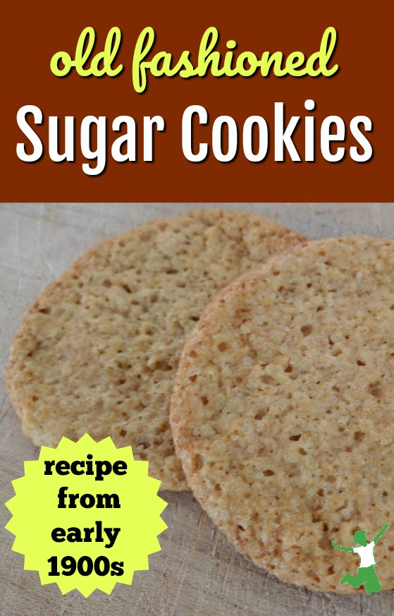 two classic sugar cookies on a cutting board