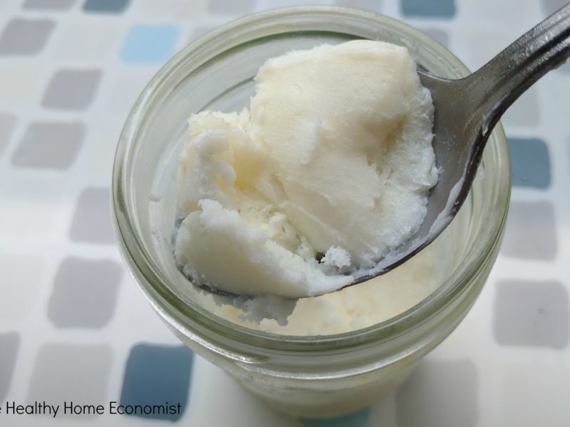 spoon of lard in a glass mason jar