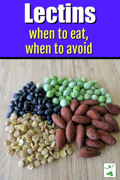 almonds, peas, beans, and lentils on a cutting board