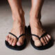 woman with nail fungus wearing a bandage over big toe