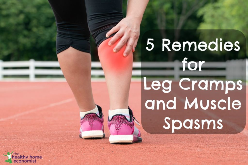 woman experiencing a painful leg cramp while exercising