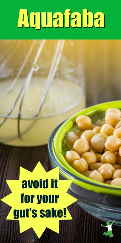 aquafaba with a whisk in a jar with a bowl of chickpeas