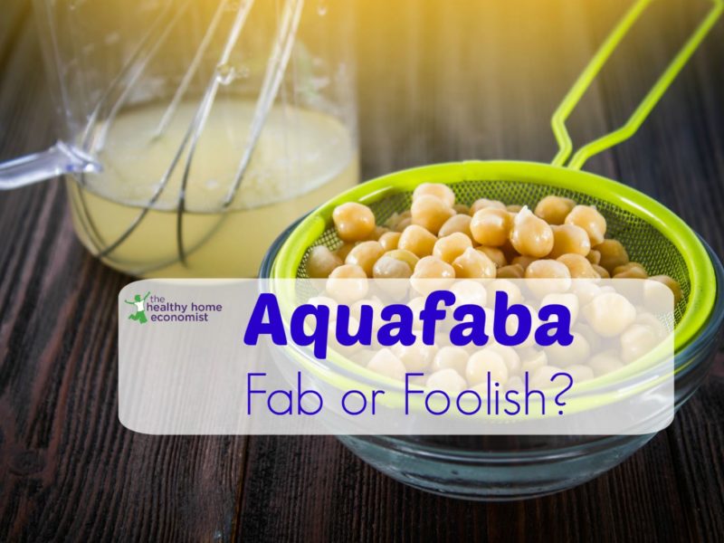 aquafaba in a glass jar with a bowl of strained chickpeas
