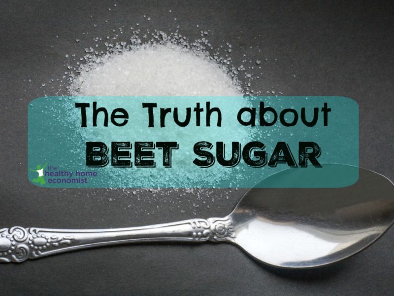 refined beet sugar on a counter next to a teaspoon