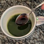 stirring date syrup into matcha tea