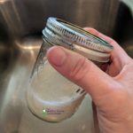 shaking mason jar to froth the milk