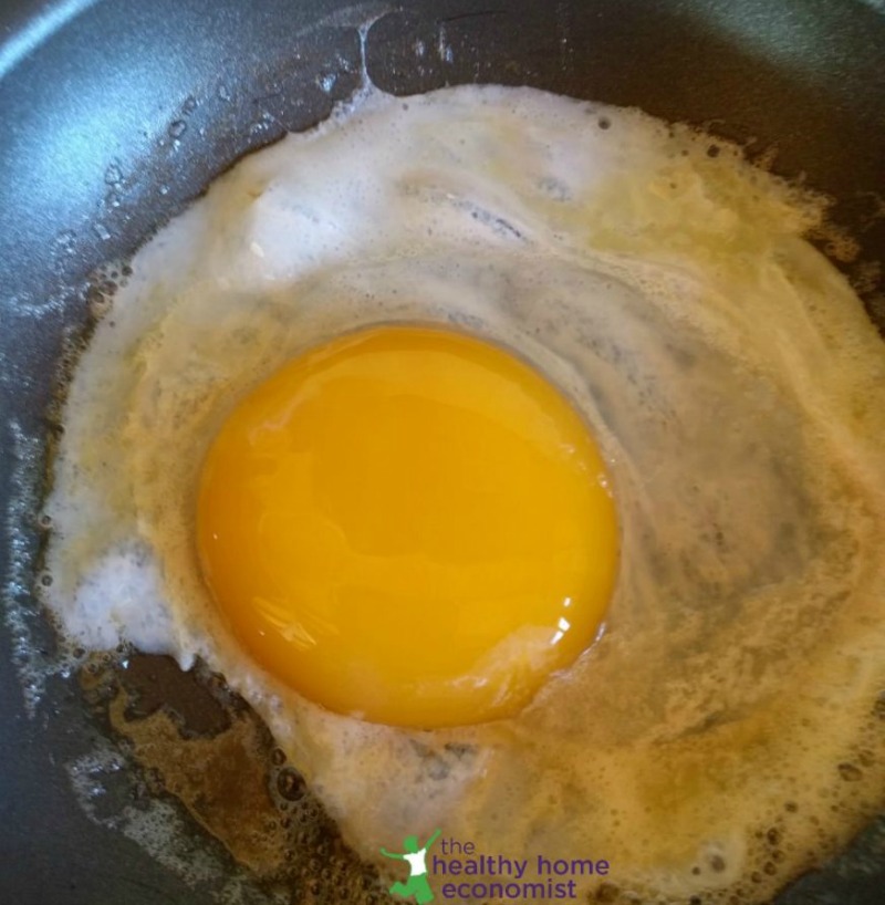 goose egg yolk and white in a pan