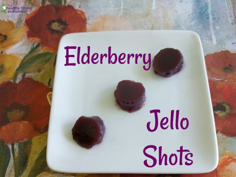 three elderberry jello shots on a white plate