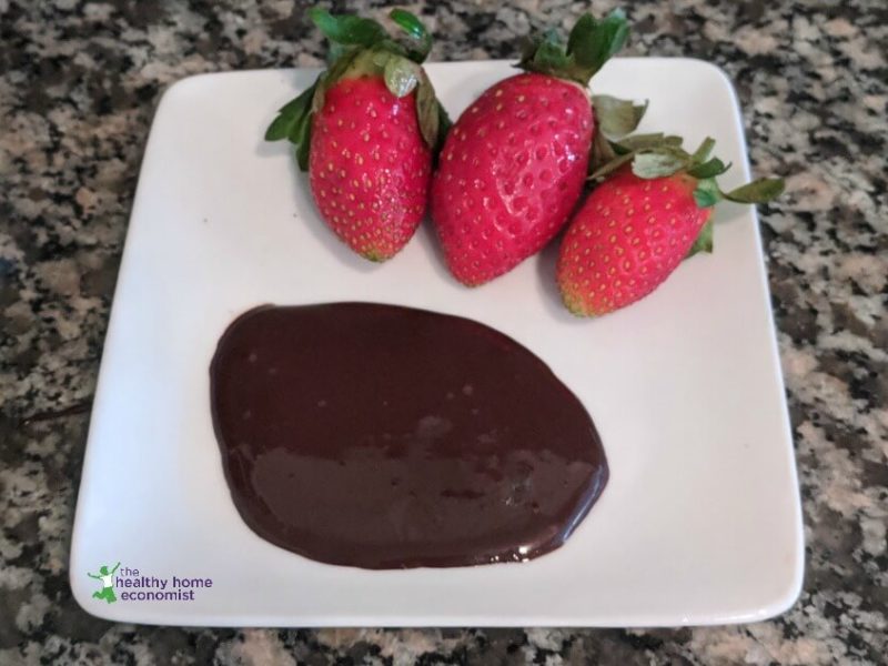 healthy fruit sweetened chocolate syrup drizzled on a plate with fruit