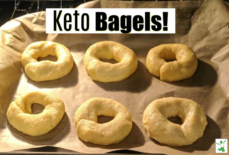 keto bagels on a cookie sheet in the oven