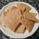 baked sourdough tortilla chips in a white bowl