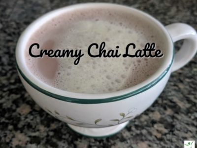 chai latte with foam on top in a mug