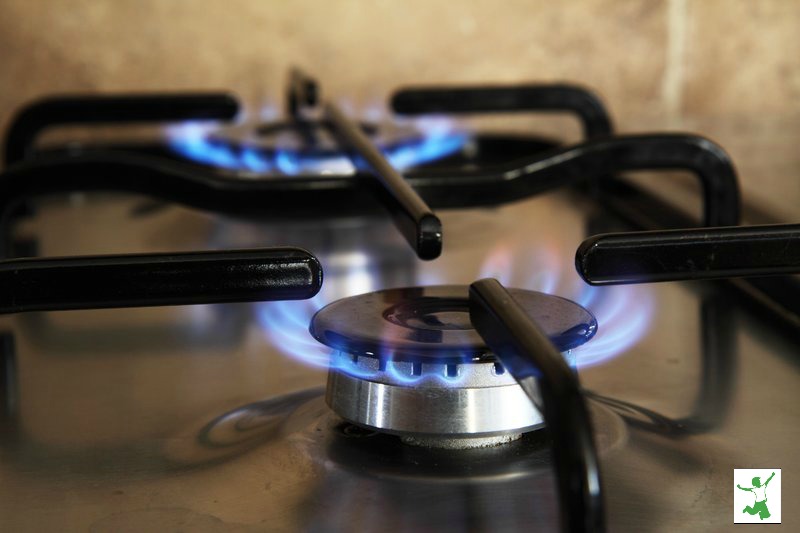 gas cooktop with two lit burners