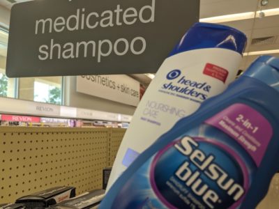 bottles of anti-dandruff shampoo at the pharmacy