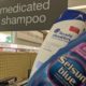 bottles of anti-dandruff shampoo at the pharmacy