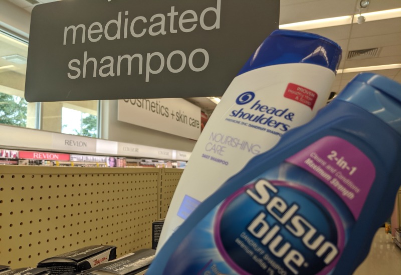 bottles of anti-dandruff shampoo at the pharmacy