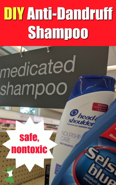 bottles of dandruff shampoo in a woman's hand