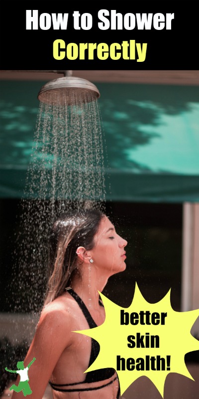 woman in a bathing suit showering under a rain shower head