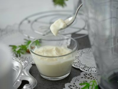 cup of nondairy yogurt on a table with a spoon