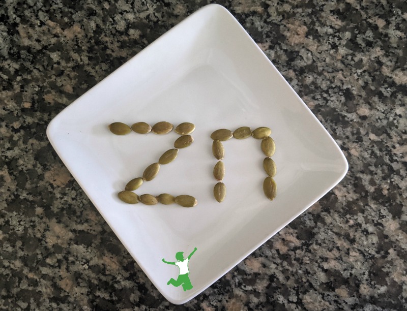 pumpkin seeds arranged in the word zinc on a plate