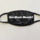 black mask on a white table