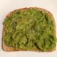 easy slice of avocado toast on a white plate