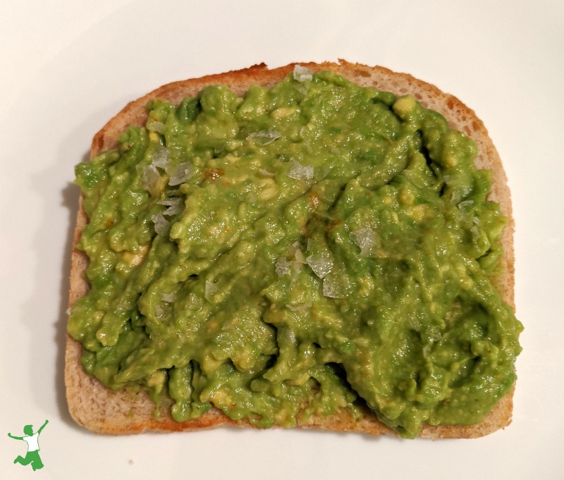 easy slice of avocado toast on a white plate