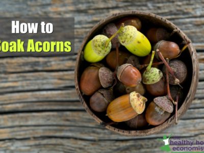 acorns in a bowl on a wooden table