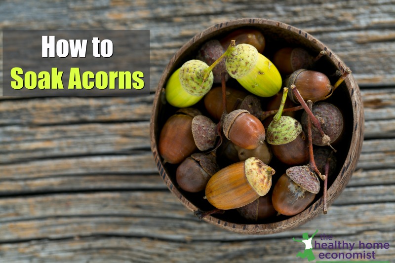 acorns in a bowl on a wooden table