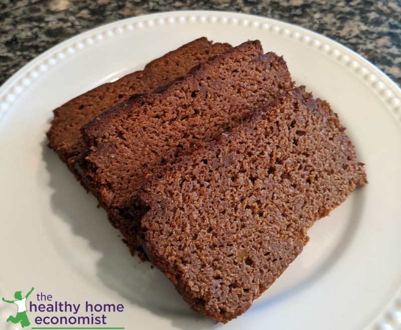 slices of low carb, grain free pumpkin bread on a decorative white plate