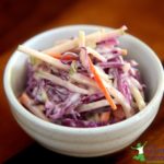 homemade coleslaw in a white ceramic cup