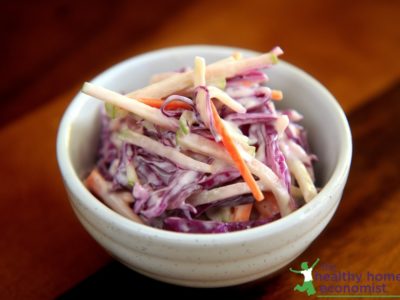 homemade coleslaw in a white ceramic cup