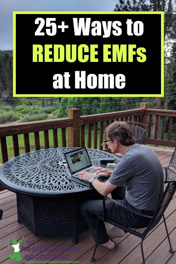 man using high EMF laptop for work on the home patio