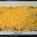 shredded cheese on top of chili dip