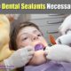 boy having dental sealants applied to teeth