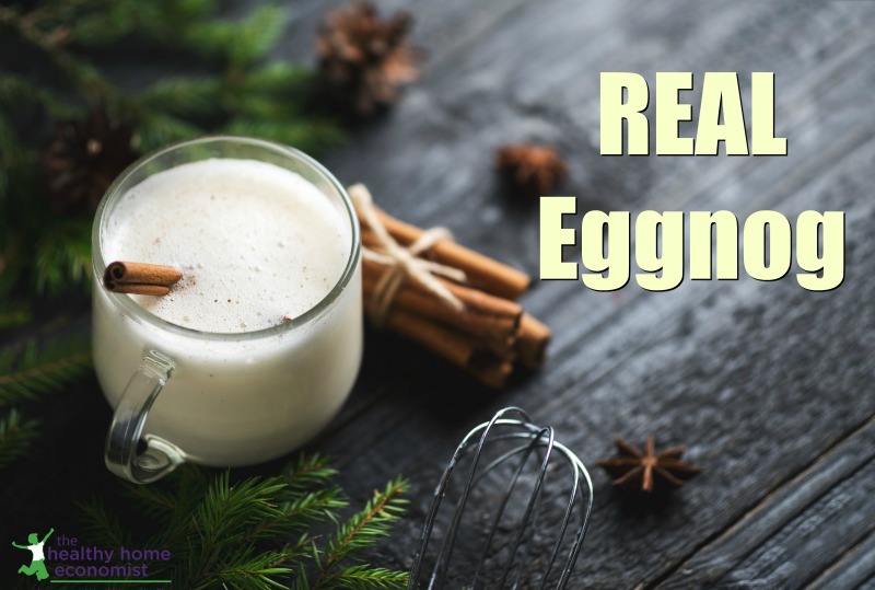 traditional eggnog in a glass with a cinnamon stick