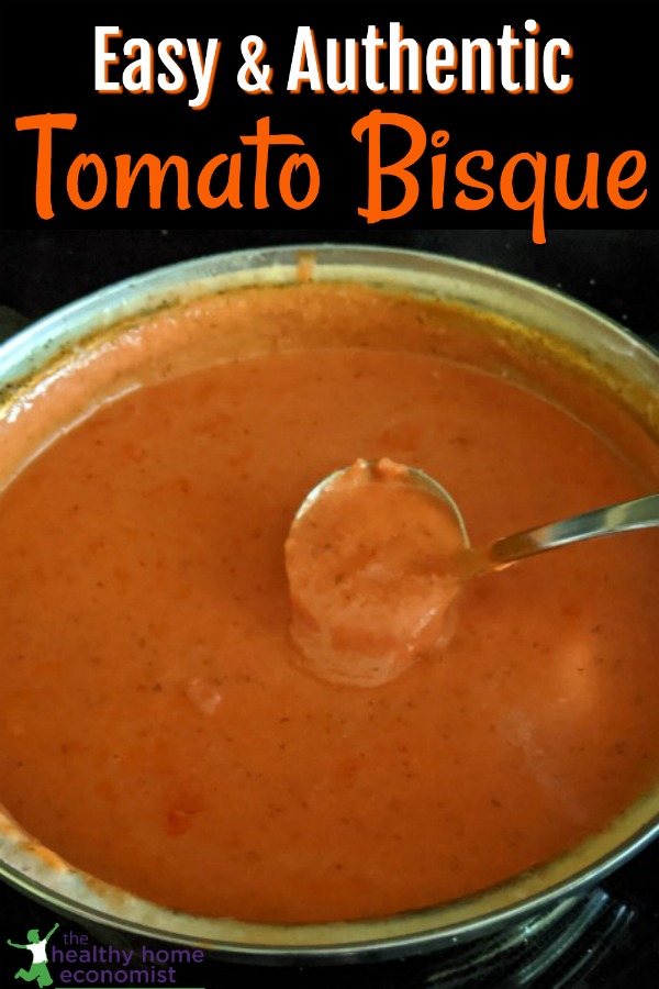 ladle in a pot of homemade tomato bisque soup