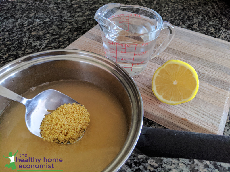 millet pearls soaking in a pot on a counter